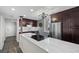Updated kitchen featuring a quartz island, stainless steel appliances, and ample storage space at 3370 Ocean Shore Blvd # 205-B, Ormond Beach, FL 32176