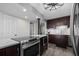 Kitchen featuring stainless appliances, a range, and an expansive granite countertop at 3370 Ocean Shore Blvd # 205-B, Ormond Beach, FL 32176