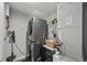 Efficient laundry area with stacked washer and dryer and storage at 3370 Ocean Shore Blvd # 205-B, Ormond Beach, FL 32176