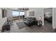 Living area with ocean views from the balcony, comfortable sofa and seamless flow into the adjacent bedroom at 3370 Ocean Shore Blvd # 205-B, Ormond Beach, FL 32176