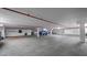 A spacious parking garage with assigned parking spots and marked parking spaces for resident vehicles at 3370 Ocean Shore Blvd # 205-B, Ormond Beach, FL 32176