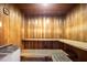 The sauna includes wooden benches for relaxation and a heater unit, offering a private space for residents at 3370 Ocean Shore Blvd # 205-B, Ormond Beach, FL 32176