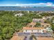 A peaceful condo community with a swimming pool and beautiful skyline in the distance at 420 Banana Cay Dr # A, South Daytona, FL 32119