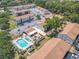 Aerial view of community showcasing pool, parking, lush landscaping and multiple buildings at 420 Banana Cay Dr # A, South Daytona, FL 32119