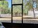 View of spacious backyard with privacy fence as seen from screened in porch at 420 Banana Cay Dr # A, South Daytona, FL 32119