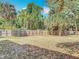 Expansive backyard with wood privacy fence and tropical landscaping at 420 Banana Cay Dr # A, South Daytona, FL 32119