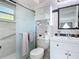 Well-lit bathroom featuring new vanity, lighting and a frosted glass shower door at 420 Banana Cay Dr # A, South Daytona, FL 32119