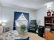 Bedroom featuring a twin bed, blue curtains, and a built-in bookshelf at 420 Banana Cay Dr # A, South Daytona, FL 32119