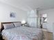 Comfortable bedroom with a view into the ensuite bathroom at 420 Banana Cay Dr # A, South Daytona, FL 32119