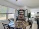 Bright dining area with a stylish marble table and decorative display cabinet at 420 Banana Cay Dr # A, South Daytona, FL 32119