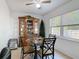 Dining area featuring a dining table set, china cabinet and a bright window, creating an inviting atmosphere at 420 Banana Cay Dr # A, South Daytona, FL 32119