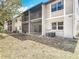 Exterior view of condo with screened in porches and lush green surroundings at 420 Banana Cay Dr # A, South Daytona, FL 32119