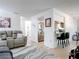Living room with tile floors and a view of kitchen with stainless steel appliances and breakfast bar at 420 Banana Cay Dr # A, South Daytona, FL 32119