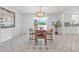 Cozy dining area with a wooden table and chairs, adjacent to the kitchen at 44 Sandra Dr, Ormond Beach, FL 32176
