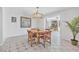 Light-filled dining area with wooden table and open view to the living room at 44 Sandra Dr, Ormond Beach, FL 32176