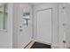 Bright entryway with tiled floors, closet, and glass-paneled front door at 44 Sandra Dr, Ormond Beach, FL 32176