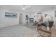 Bright living room with tiled floors, ceiling fans, and large picture window at 44 Sandra Dr, Ormond Beach, FL 32176