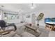 Spacious living room with bright tiled floors and ceiling fans for comfort at 44 Sandra Dr, Ormond Beach, FL 32176