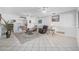 Open living room with tile floors, and an archway leading to other rooms at 44 Sandra Dr, Ormond Beach, FL 32176