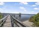 Picturesque pier with gazebo overlooking tranquil waters and distant shoreline at 44 Sandra Dr, Ormond Beach, FL 32176