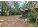 Spacious backyard surrounded by mature trees and a covered patio at 440 Champagne Cir, Port Orange, FL 32127