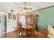Dining room with hardwood floors, a ceiling fan, and traditional wooden furniture at 440 Champagne Cir, Port Orange, FL 32127