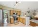 Open kitchen with stainless steel appliances, tile backsplash, and a breakfast bar at 440 Champagne Cir, Port Orange, FL 32127