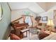 Cozy living room with grand piano, vaulted ceiling and large arched window at 440 Champagne Cir, Port Orange, FL 32127