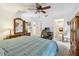 Main bedroom has a ceiling fan, a desk and an ensuite bathroom at 440 Champagne Cir, Port Orange, FL 32127