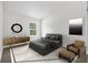 Bright bedroom featuring sleek furniture, a large window, and modern decor, offering a peaceful retreat at 5620 Ridgewood Ave, De Leon Springs, FL 32130