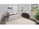 This stylish bedroom features a luxurious bed, modern furnishings, and large windows offering bright natural light at 5620 Ridgewood Ave, De Leon Springs, FL 32130