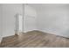 An airy, light-filled bedroom with wood-look floors and a double closet at 5620 Ridgewood Ave, De Leon Springs, FL 32130