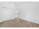 A light-filled bedroom with wood-look floors and a double closet at 5620 Ridgewood Ave, De Leon Springs, FL 32130