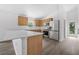 Modern kitchen featuring stainless steel appliances and light wood cabinets at 5620 Ridgewood Ave, De Leon Springs, FL 32130