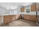 Spacious kitchen island with stainless steel appliances and wood cabinets at 5620 Ridgewood Ave, De Leon Springs, FL 32130