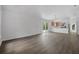 Open-concept living room with sliding glass doors and views into the kitchen at 5620 Ridgewood Ave, De Leon Springs, FL 32130