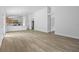 Bright, open-concept living space featuring vinyl floors and natural light at 5620 Ridgewood Ave, De Leon Springs, FL 32130