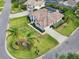 Aerial view of home with lush landscaping, tile roof, inviting curb appeal, and well-maintained surroundings at 6 Talaquah Blvd, Ormond Beach, FL 32174