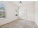 Bedroom with bright walls, closet, and plantation shutters at 6 Talaquah Blvd, Ormond Beach, FL 32174