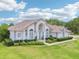 Beautiful home showcasing lush landscaping, well-maintained lawn, and inviting curb appeal with a tile roof at 6 Talaquah Blvd, Ormond Beach, FL 32174