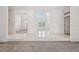 Elegant foyer with tile flooring, high ceilings, and a view of the front entrance at 6 Talaquah Blvd, Ormond Beach, FL 32174