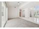 Spacious living room with high ceilings, tile flooring, and abundant natural light at 6 Talaquah Blvd, Ormond Beach, FL 32174