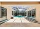 Spacious covered patio overlooking a screened-in pool area, ideal for outdoor living at 6 Talaquah Blvd, Ormond Beach, FL 32174