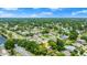 Discover a peaceful residential area surrounded by lush greenery and serene lakes from this elevated aerial perspective at 912 Fruitwood Pl, Port Orange, FL 32127