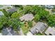 An aerial shot shows a well-maintained property, complete with lush greenery, a private yard, and a serene neighborhood setting at 912 Fruitwood Pl, Port Orange, FL 32127