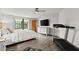 Bedroom featuring a treadmill, ceiling fan, and view of the yard at 912 Fruitwood Pl, Port Orange, FL 32127