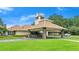 Clubhouse featuring covered parking and manicured lawns, offering a convenient and welcoming experience at 912 Fruitwood Pl, Port Orange, FL 32127