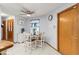 Cozy dining area with a round table, four chairs, ceiling fan, and natural light at 912 Fruitwood Pl, Port Orange, FL 32127