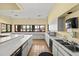 Spacious community kitchen featuring ample counter space, white cabinetry, and modern appliances at 912 Fruitwood Pl, Port Orange, FL 32127