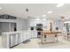 Bright kitchen featuring stainless steel appliances, white cabinetry, a large center island, and modern countertops at 912 Fruitwood Pl, Port Orange, FL 32127